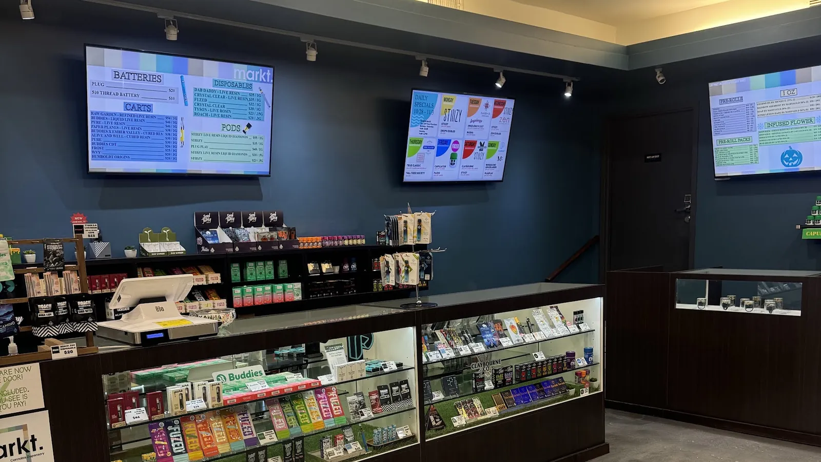 Markt. sales floor with display counters and menu screens